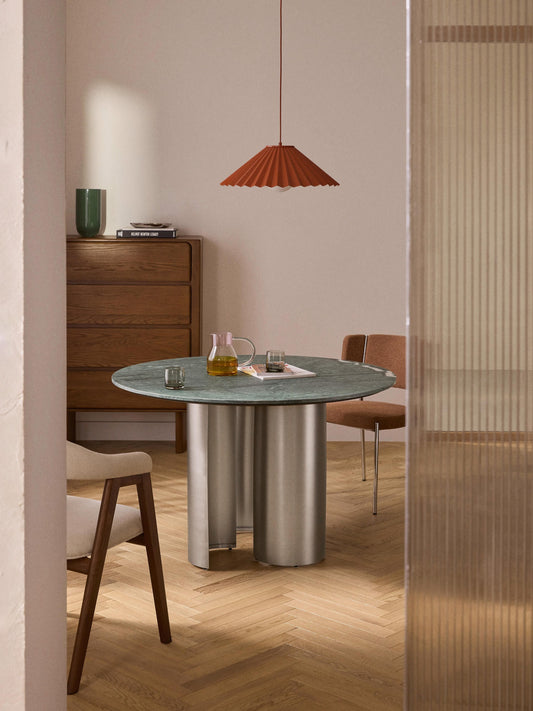 Round marble dining table in a cosy dining room