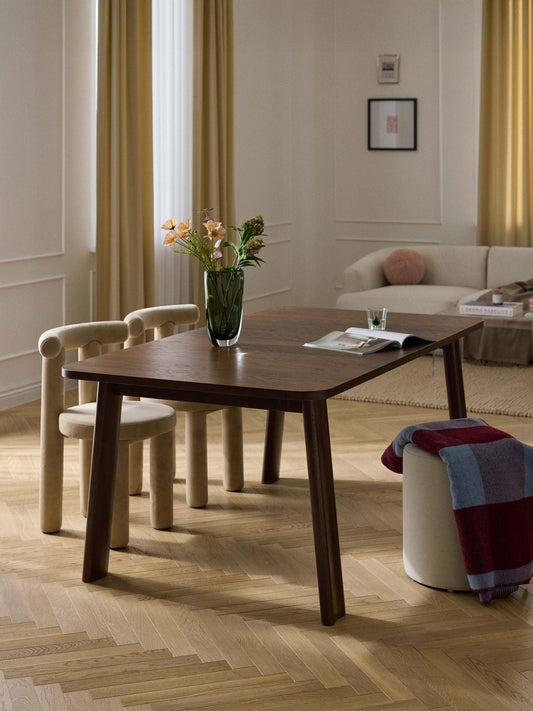 Extendable dining table with chairs in a dining room